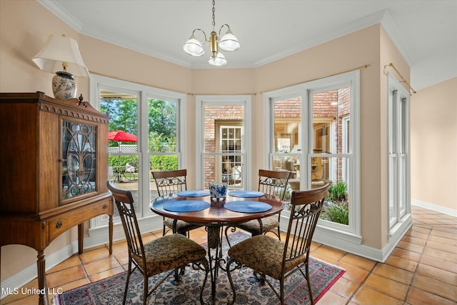 dining area with light tile patterned flooring, baseboards, ornamental molding, and a notable chandelier