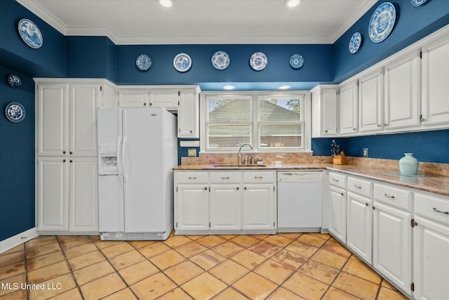 kitchen with white cabinets, a sink, light stone countertops, ornamental molding, and white appliances