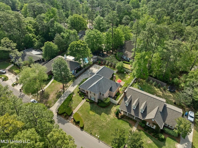 aerial view featuring a wooded view