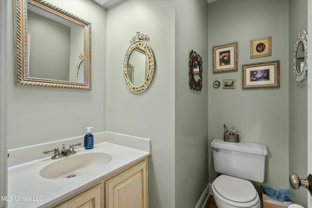 half bath with toilet and vanity