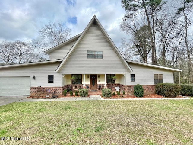 view of front of property featuring a garage, a front yard, and a porch