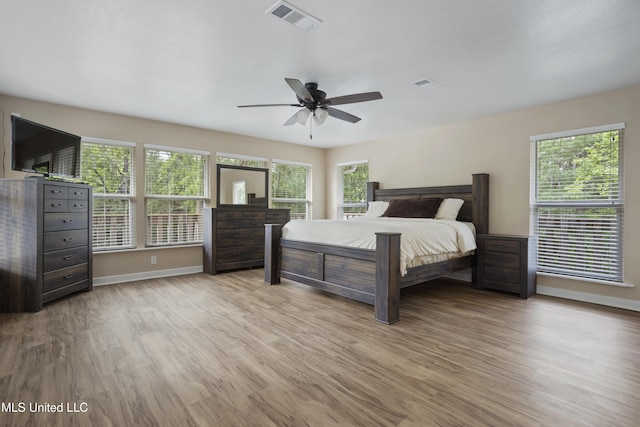 5297 Tuxachanie Dr, Biloxi, MS 39532 - bedroom featuring wood finished floors, baseboards, and ceiling fan