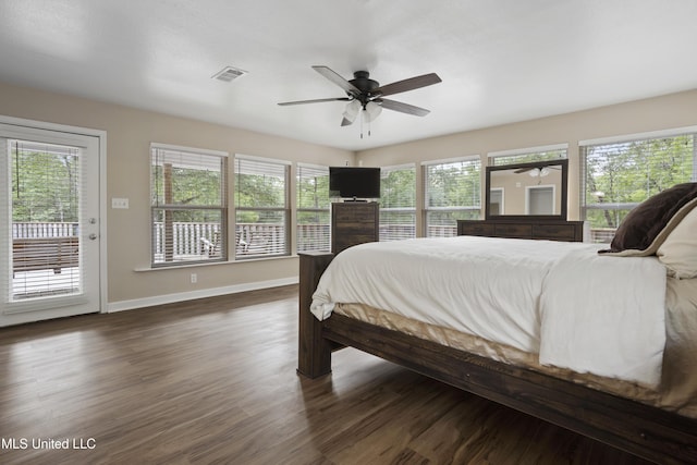 5297 Tuxachanie Dr, Biloxi, MS 39532 - bedroom with access to exterior, dark wood finished floors, baseboards, and ceiling fan