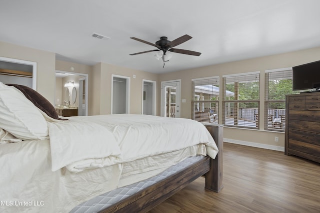 5297 Tuxachanie Dr, Biloxi, MS 39532 - bedroom featuring baseboards, wood finished floors, ceiling fan, and ensuite bathroom