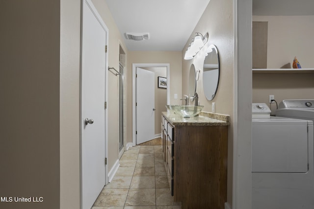5297 Tuxachanie Dr, Biloxi, MS 39532 - full bath with washing machine and clothes dryer and vanity