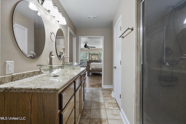 5297 Tuxachanie Dr, Biloxi, MS 39532 - bathroom featuring ceiling fan, ensuite bath, and a stall shower