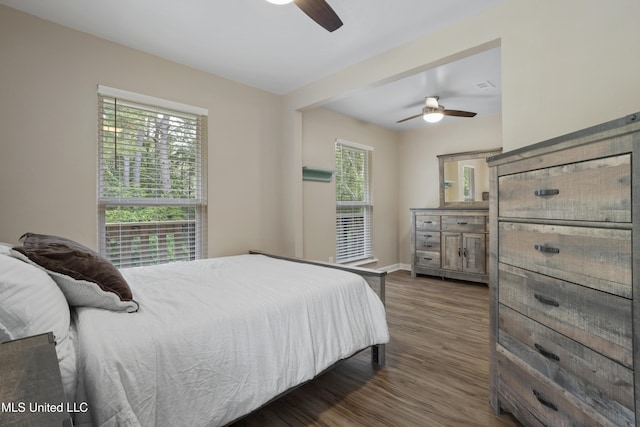 5297 Tuxachanie Dr, Biloxi, MS 39532 - bedroom featuring dark wood-style floors, baseboards, and a ceiling fan