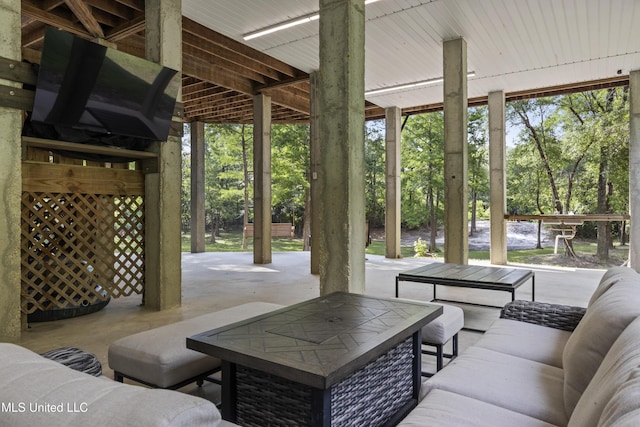 5297 Tuxachanie Dr, Biloxi, MS 39532 - view of patio featuring outdoor lounge area and view of wooded area
