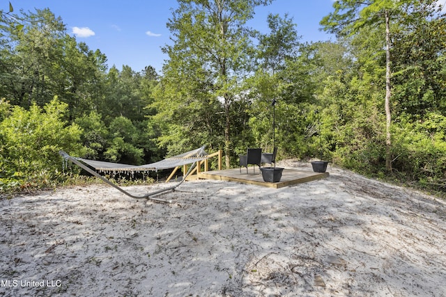 5297 Tuxachanie Dr, Biloxi, MS 39532 - view of patio featuring a wooded view
