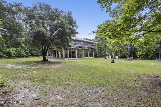 5297 Tuxachanie Dr, Biloxi, MS 39532 - view of grassy yard featuring a deck