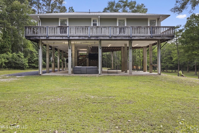 5297 Tuxachanie Dr, Biloxi, MS 39532 - back of house featuring a yard, a patio area, a deck, and metal roof