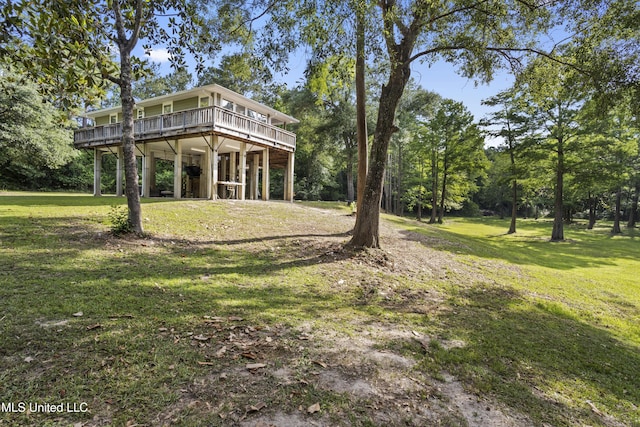 5297 Tuxachanie Dr, Biloxi, MS 39532 - view of grassy yard featuring a wooden deck