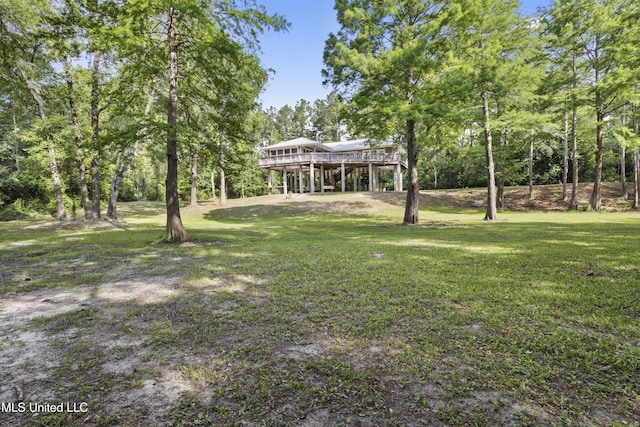 5297 Tuxachanie Dr, Biloxi, MS 39532 - view of green lawn featuring a deck