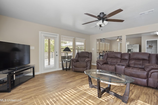 5297 Tuxachanie Dr, Biloxi, MS 39532 - living area with a ceiling fan, light wood finished floors, and baseboards