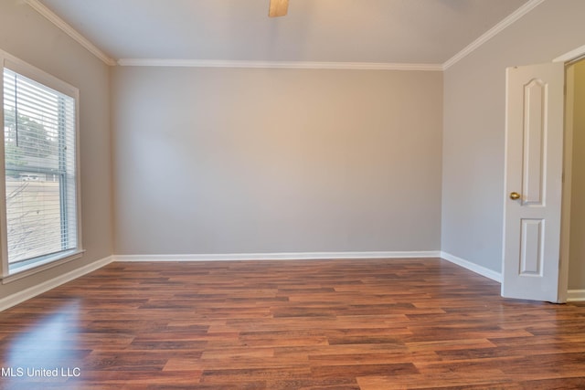 unfurnished room featuring dark wood-style floors, baseboards, and crown molding