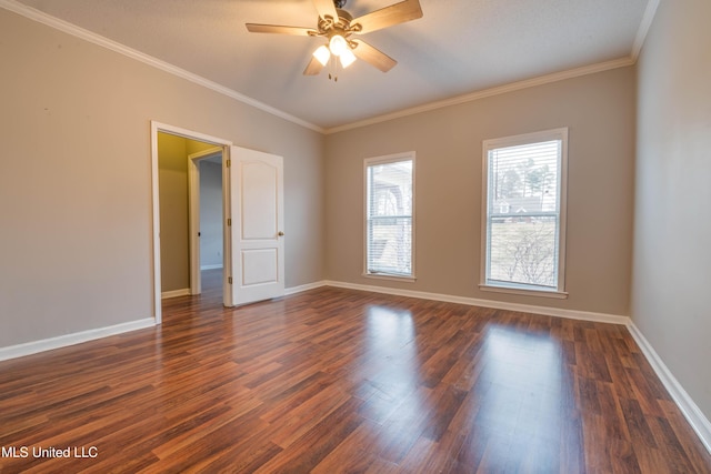 unfurnished room with dark wood-style floors, ceiling fan, ornamental molding, and baseboards