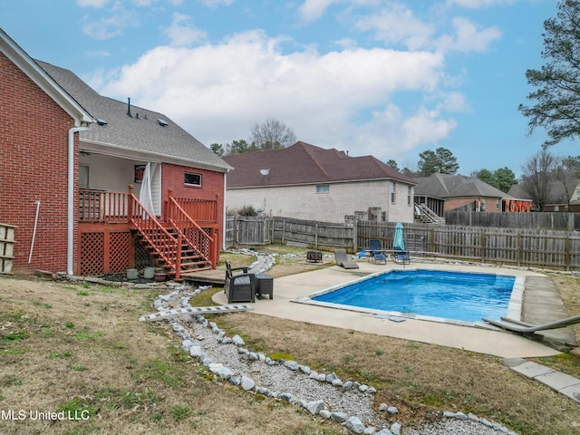 view of swimming pool with a fenced in pool, a fenced backyard, stairway, a deck, and a patio area