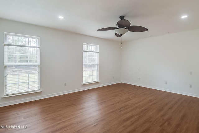 unfurnished room featuring ceiling fan, baseboards, dark wood-style flooring, and recessed lighting