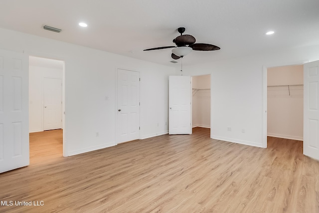 unfurnished bedroom featuring light wood-style flooring, recessed lighting, visible vents, and baseboards