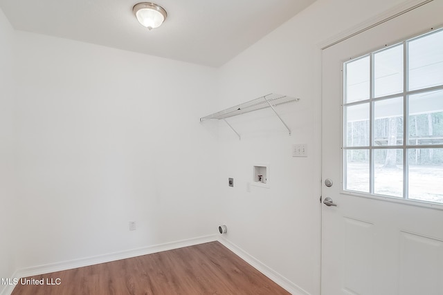 laundry room with laundry area, baseboards, wood finished floors, hookup for an electric dryer, and washer hookup