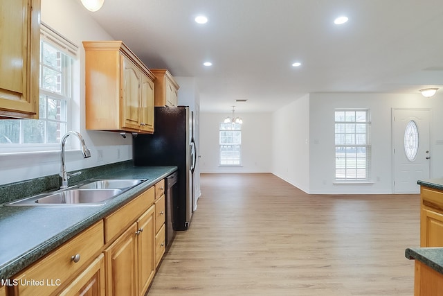 kitchen featuring light wood-style flooring, recessed lighting, a sink, dishwasher, and dark countertops