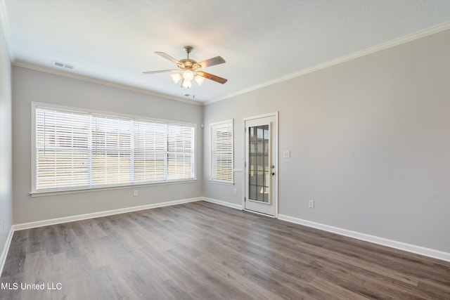 empty room with crown molding, dark hardwood / wood-style floors, and ceiling fan