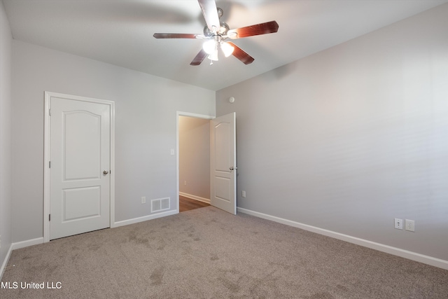 unfurnished bedroom featuring ceiling fan and carpet