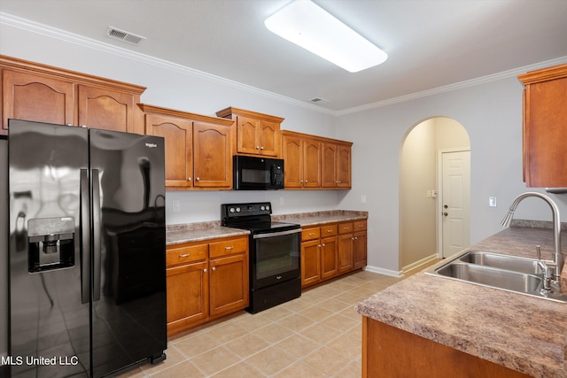 kitchen featuring crown molding, black appliances, and sink