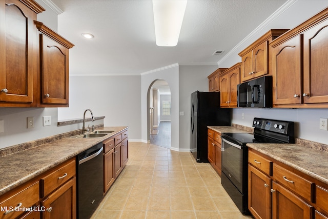 kitchen featuring crown molding, black appliances, sink, and light tile patterned floors