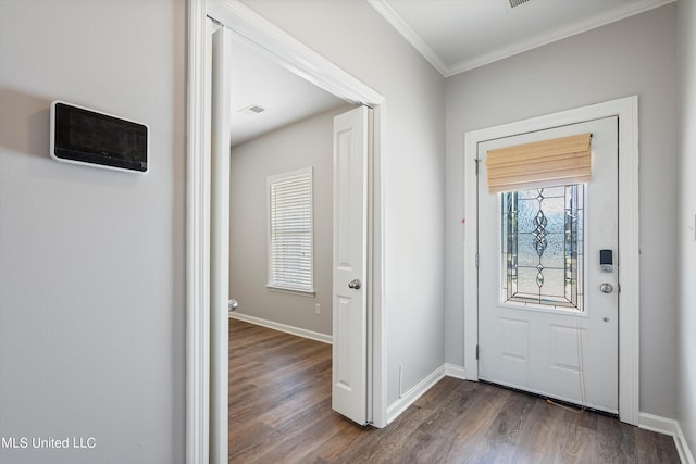 entrance foyer featuring crown molding and dark hardwood / wood-style floors