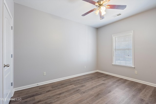 unfurnished room featuring dark hardwood / wood-style floors and ceiling fan