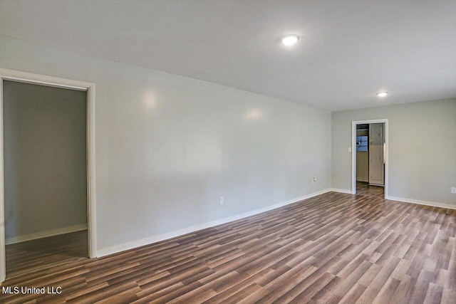 empty room featuring dark hardwood / wood-style floors