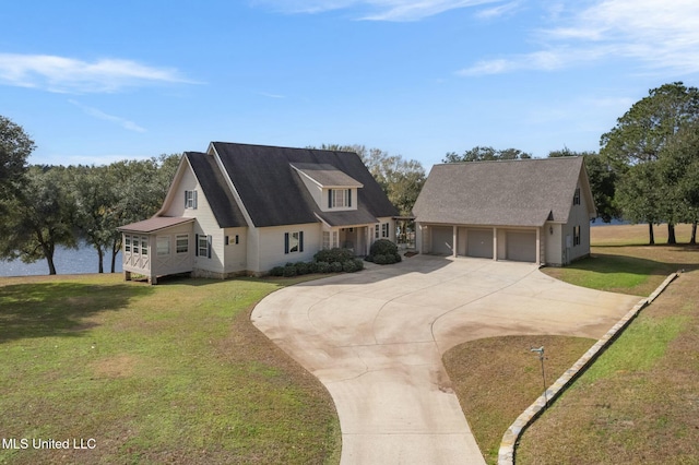 view of front of home with a front lawn and a garage