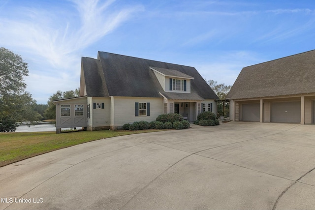 view of front of home with a garage and a front yard