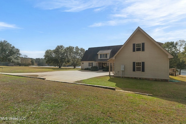 back of house featuring a yard