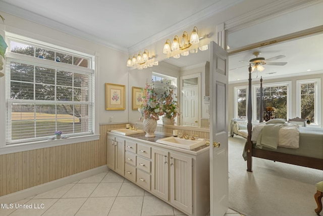 bathroom featuring ceiling fan, crown molding, wood walls, and vanity