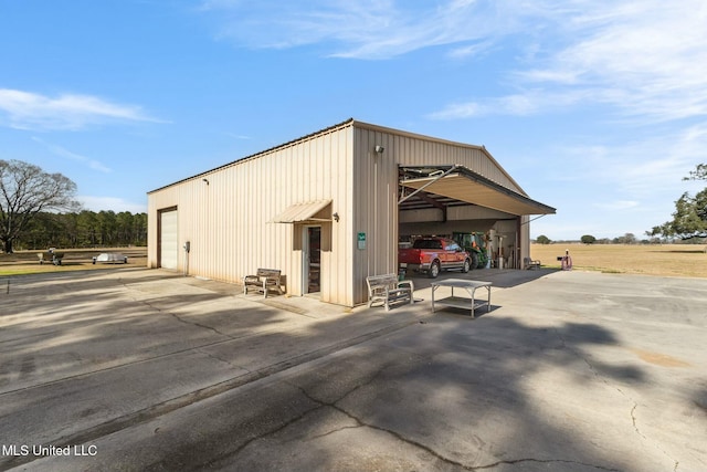 view of outbuilding featuring a garage