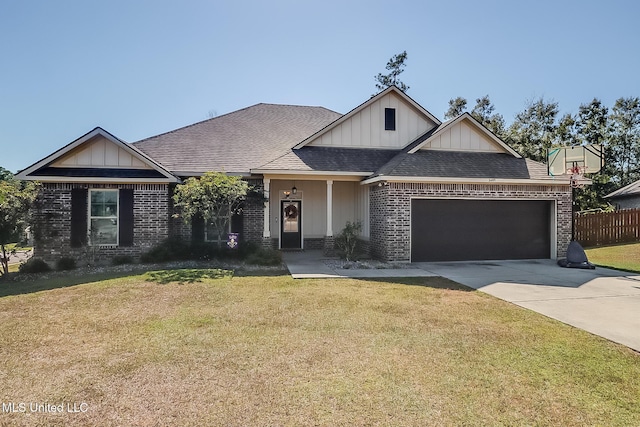 craftsman-style house featuring a front lawn and a garage