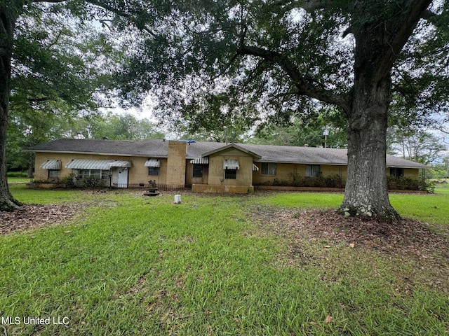 ranch-style house with a front lawn