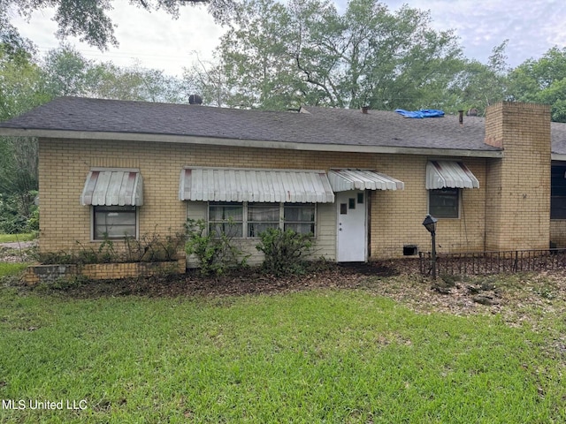 view of front of home with a front yard