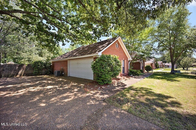 505 Golden Eagle Dr, Byram, MS 39272 - view of side of home with brick siding, a garage, and driveway