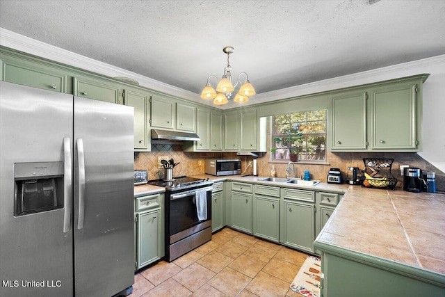 505 Golden Eagle Dr, Byram, MS 39272 - kitchen featuring appliances with stainless steel finishes, green cabinets, ornamental molding, a chandelier, and under cabinet range hood