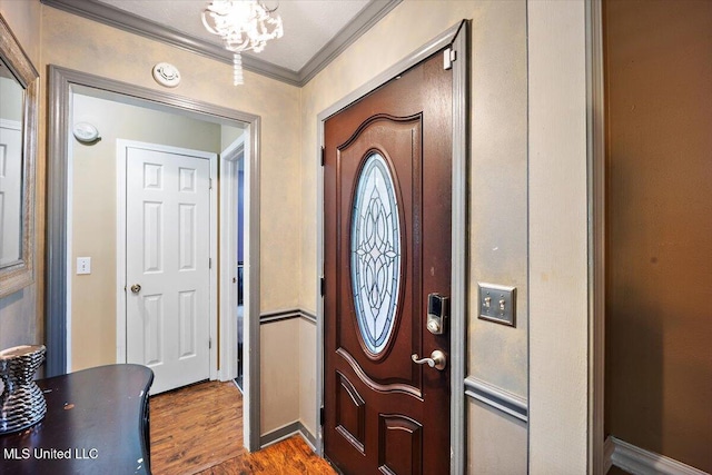 505 Golden Eagle Dr, Byram, MS 39272 - foyer featuring crown molding and dark wood-type flooring