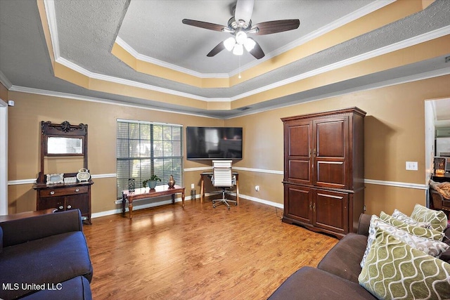 505 Golden Eagle Dr, Byram, MS 39272 - living area with a raised ceiling, light wood finished floors, ceiling fan, and ornamental molding