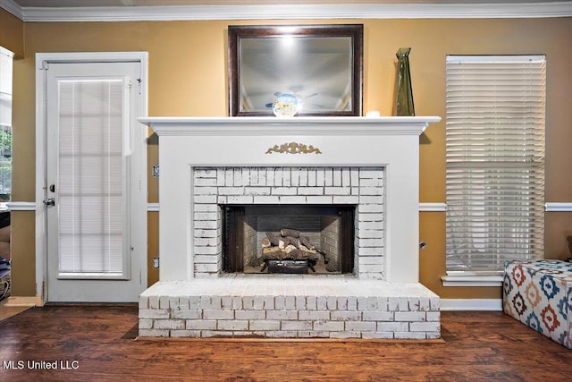 505 Golden Eagle Dr, Byram, MS 39272 - detailed view of crown molding, a brick fireplace, and wood finished floors