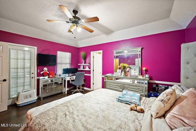 505 Golden Eagle Dr, Byram, MS 39272 - bedroom featuring a textured ceiling, a desk, wood finished floors, and a ceiling fan