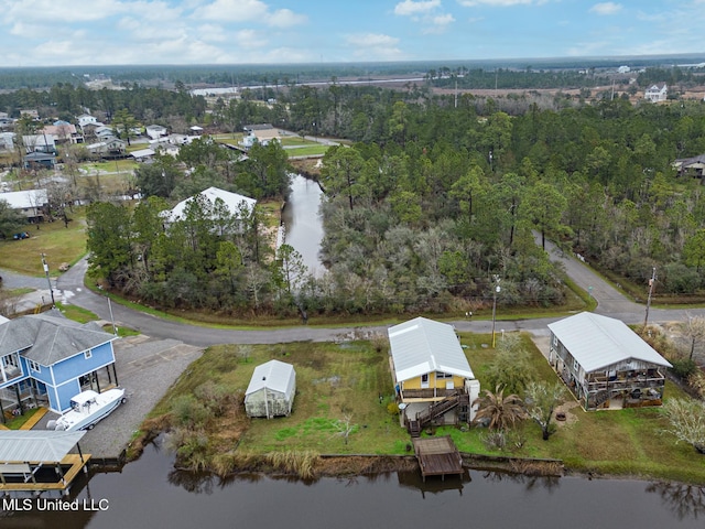 drone / aerial view featuring a water view and a residential view