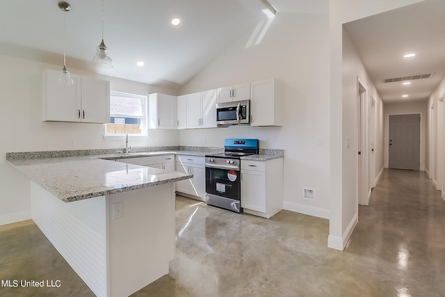 kitchen with white cabinets, pendant lighting, lofted ceiling, and stainless steel appliances