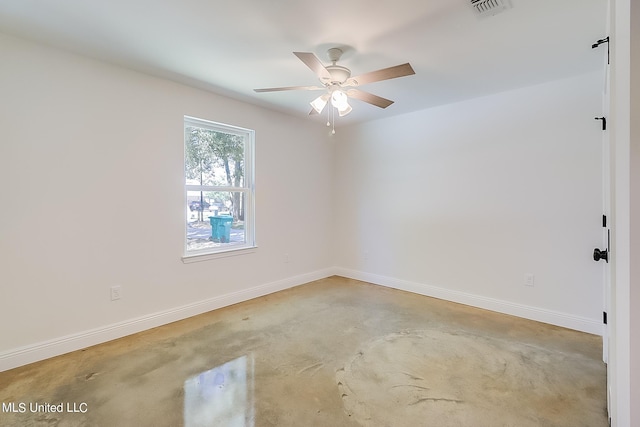 empty room with concrete floors and ceiling fan