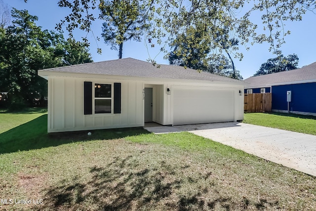 single story home with a front lawn and a garage